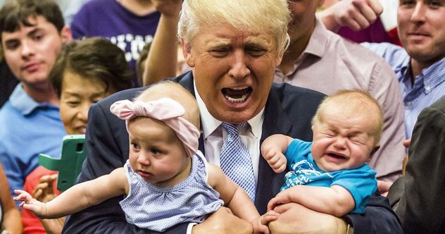 Trump holding two babies